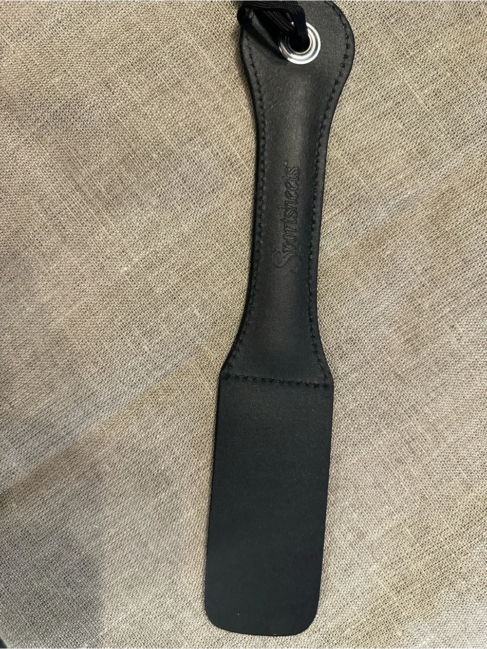 Black Leather Paddle with Embossed Lettering and Wrist Loop